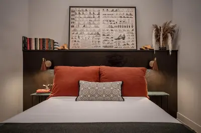 a bedroom with a bed with a headboard and a pillow at Exquisite Artisan Loft w Chic Design - The Cobbler in Philadelphia