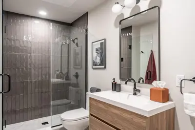 a bathroom with a sink and a toilet and a shower at Exquisite Artisan Loft w Chic Design - The Cobbler in Philadelphia