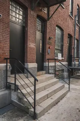 a set of stairs in front of a building at Exquisite Artisan Loft w Chic Design - The Cobbler in Philadelphia