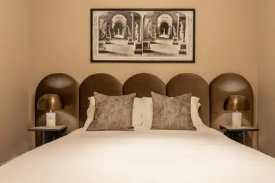 a bedroom with a large bed with two lamps at Chic Artisan Loft w Stylish Design - The Sculptor in Philadelphia