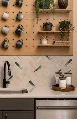 a kitchen with a sink and a counter with plants at Stylish Artisan Loft w Chic Design - The Potter in Philadelphia
