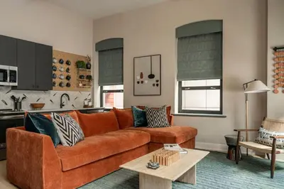 a living room with a couch and a table at Stylish Artisan Loft w Chic Design - The Potter in Philadelphia