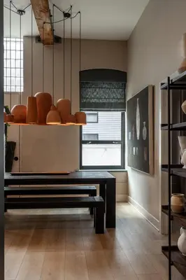 a room with a bench and a bunch of vases at Stylish Artisan Loft w Chic Design - The Potter in Philadelphia