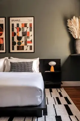 a bedroom with a white bed and a rug at The Artisan's Townhome - 4Bed Roofdeck - The King in Philadelphia