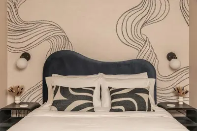 a bedroom with a bed with a black and white headboard at The Artisan's Duplex - 8Bed -5Bath with 2 Car Parking in Philadelphia