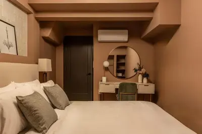 a bedroom with a bed and a desk and a mirror at The Artisan's Duplex - 8Bed -5Bath with 2 Car Parking in Philadelphia