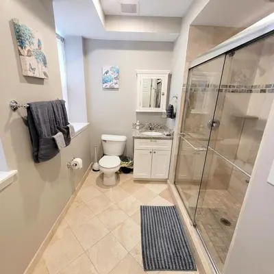 a bathroom with a shower and a toilet at Center City - Modern 2 Bedroom in Philadelphia