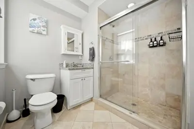 a bathroom with a toilet and a shower at Center City - Modern 2 Bedroom in Philadelphia