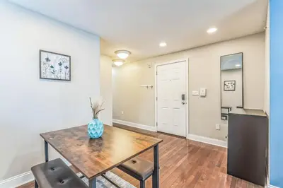 a dining room with a table and two chairs at Modern 2 bedroom - Center City in Philadelphia