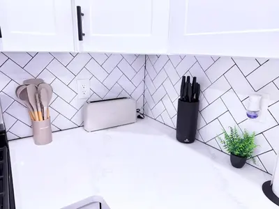 a kitchen counter with utensils and a toaster at Luxury Stay in Newark