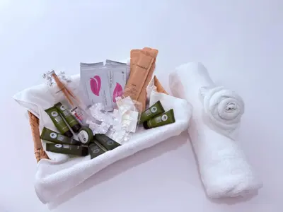 a basket filled with toiletries and a towel at Luxury Stay in Newark