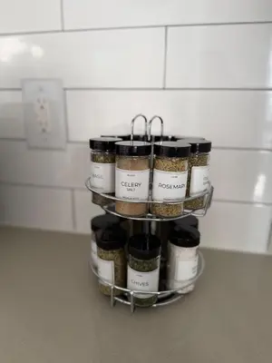 a spice rack in a kitchen with spices on it at Chic & Comfy Apartment
