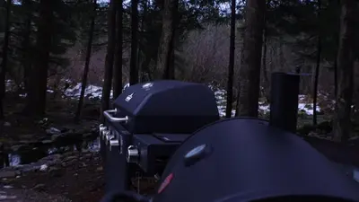 a row of suitcases sitting in the woods at Secluded Forest Escape with Game Room, Hot Tub and Fire Pit in Thornhurst