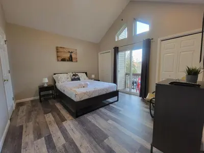 a bedroom with a bed and a large window at GreatEscape Nature Playground HiSpeedInternet in Long Pond