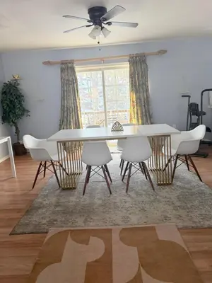 a dining room with a table and chairs at Poconos home away from home in East Stroudsburg