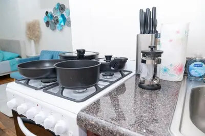 two pans sitting on top of a stove in a kitchen at Stylish2 Upper West Side Apartment 5-Min Walk to Central Park in New York