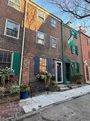 a brick house with a bench in front of it at Charming Trinity in Center City, Philadelphia in Philadelphia