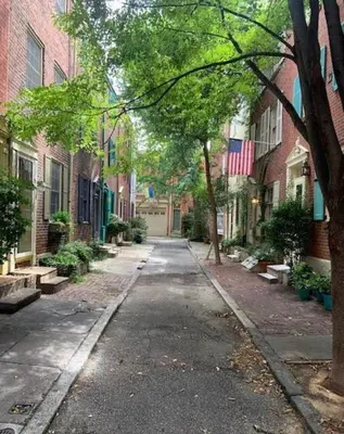 an empty street in a city with buildings at Charming Trinity in Center City, Philadelphia in Philadelphia