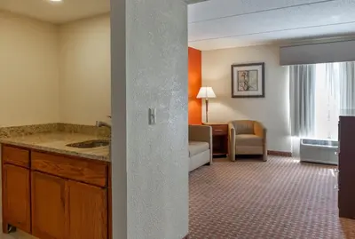 a hotel room with a sink and a living room at Holiday Inn Express Harrisburg SW - Mechanicsburg by IHG in Mechanicsburg