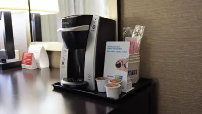a coffee maker on a shelf in a hotel room at Holiday Inn Express & Suites Gibson by IHG in New Milford