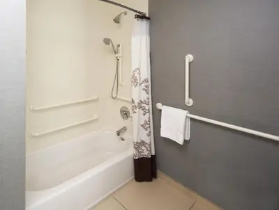 a bathroom with a white tub and a shower at Residence Inn by Marriott Philadelphia Airport in Philadelphia