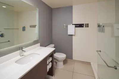 a bathroom with a sink and a toilet and a shower at Residence Inn by Marriott Philadelphia Airport in Philadelphia