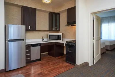 a kitchen with a refrigerator and a microwave at Residence Inn by Marriott Philadelphia Airport in Philadelphia