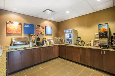 a fast food restaurant with a counter with food at Comfort Inn PA Turnpike - I-81 in Carlisle