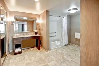a bathroom with two sinks and a shower at Homewood Suites by Hilton Bridgewater/Branchburg in Branchburg Park