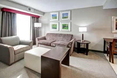 a living room with a couch and a table at Homewood Suites by Hilton Bridgewater/Branchburg in Branchburg Park