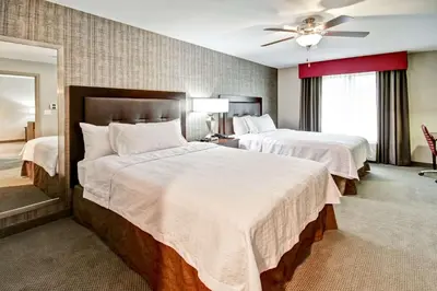 a hotel room with two beds and a ceiling fan at Homewood Suites by Hilton Bridgewater/Branchburg in Branchburg Park