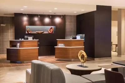 a lobby of a hotel with a waiting room at Courtyard by Marriott Elmira Horseheads in Horseheads