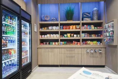 a store refrigerator with lots of food and drinks at SpringHill Suites by Marriott Somerset Franklin Township in Somerset