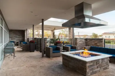 a patio with a fire pit and a stove at SpringHill Suites by Marriott Somerset Franklin Township in Somerset