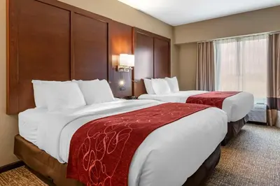 a hotel room with two beds and a window at Comfort Suites Manheim - Lancaster in Manheim