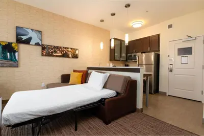 a small room with a bed and a kitchen at Residence Inn by Marriott Philadelphia Great Valley/Malvern in Malvern