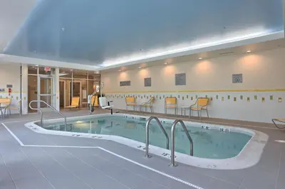 a large swimming pool in the middle of a building at Fairfield by Marriott Inn & Suites Philadelphia Horsham in Willow Grove