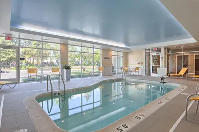a large swimming pool in a hotel room at Fairfield by Marriott Inn & Suites Philadelphia Horsham in Willow Grove