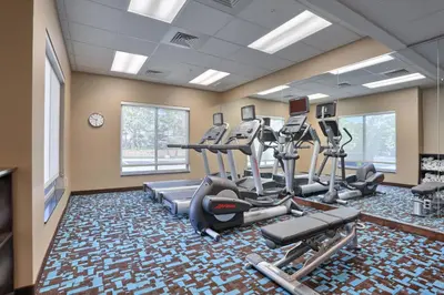 a gym with treadmills and ellipticals in a room at Fairfield by Marriott Inn & Suites Philadelphia Horsham in Willow Grove