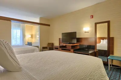 a hotel room with two beds and a flat screen tv at Fairfield by Marriott Inn & Suites Philadelphia Horsham in Willow Grove