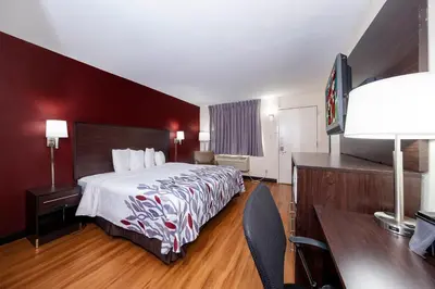 a hotel room with a bed and a desk at Red Roof Inn Bordentown - McGuire AFB in Bordentown