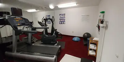 a room with a gym with a treadmill at Holiday Inn Express Hotel & Suites West Point-Fort Montgomery by IHG in Fort Montgomery