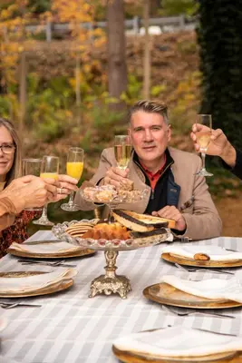 a group of people sitting at a table with wine glasses at Hollinger House in Lancaster