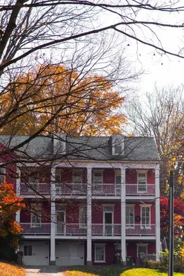 a red and white house with a balcony at Hollinger House in Lancaster
