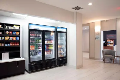 a store with two large refrigerators in a room at Holiday Inn Express Hotel & Suites Chester by IHG in Chester