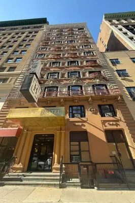 a tall building with a clock on top of it at Heritage Hotel New York City in New York
