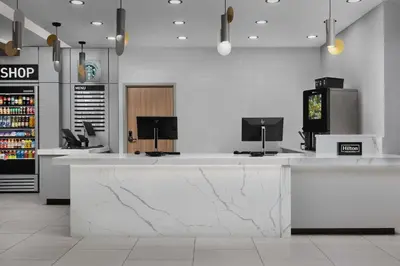 a large white counter in a store with a tv at Homewood Suites by Hilton York in York