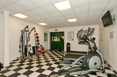 a gym with two treadmills and two ellipticals at Spring Gulch Screened Park Model 6 in Mount Airy