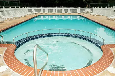 a large swimming pool with chairs around it at Spring Gulch Chalet 12 in Mount Airy