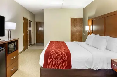a hotel room with a large bed and a flat screen tv at Comfort Inn Lancaster at Rockvale in Lancaster